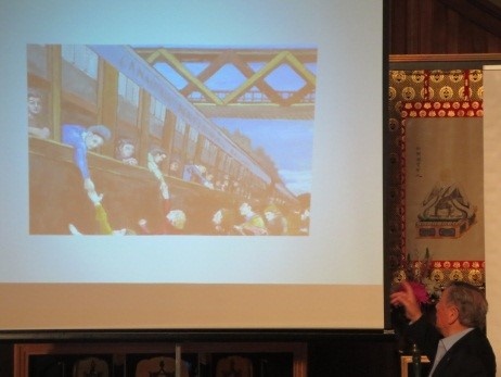Dr. Shimizu shows the slides of his paintings from the internment camp