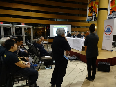 Audience members participate in a Q&A session