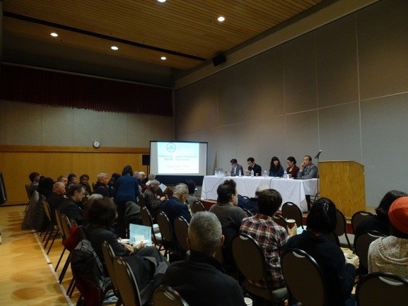 Audience and participants gather for the start of the forum