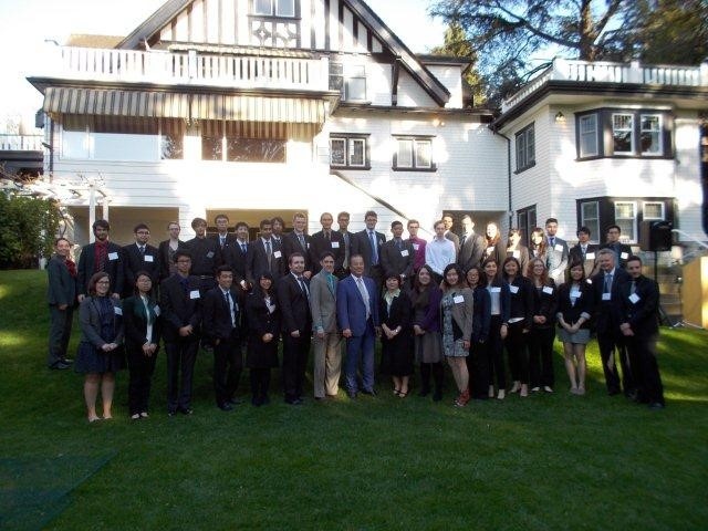 A group photo of interns, Mr. Hill, the program staffs and Mr. and Mrs. Okada.