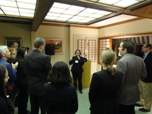 Returning participants recount their memories for guests.