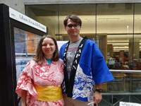 Visitors wearing yukata and posing for a photo