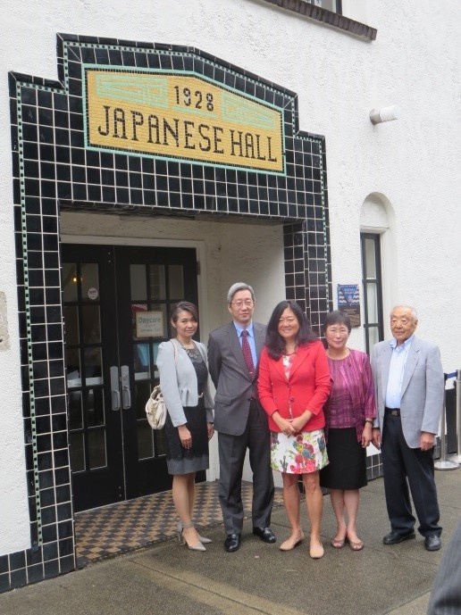 Minister Yamamoto in front of the Vancouver Japanese Language School and Japanese Hall