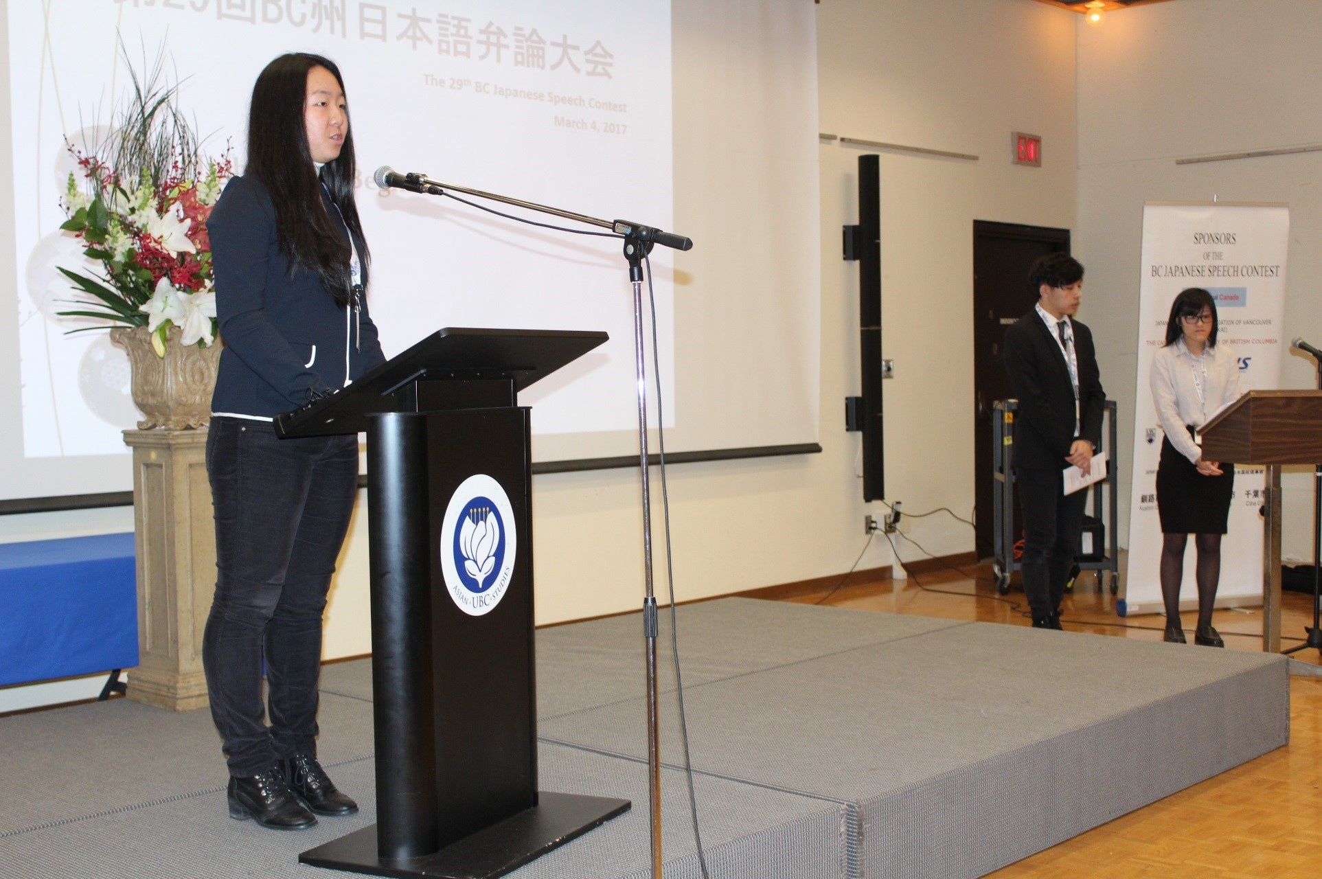 A contestant performs her speech